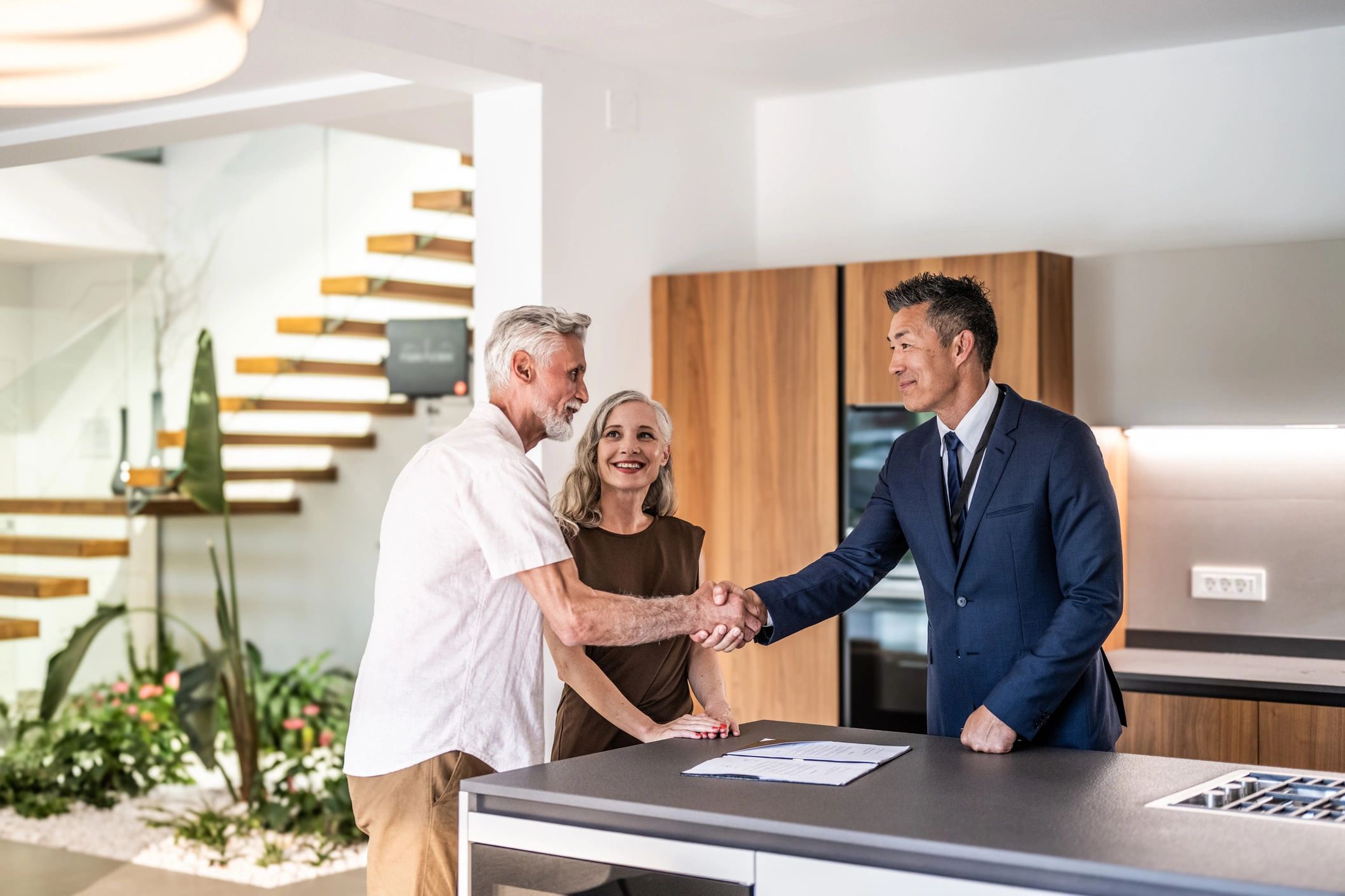 Clients reviewing investment property documents
